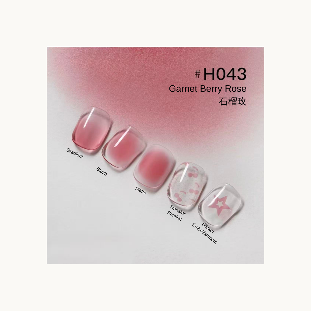 Taye Nformula Life garnet berry rose press-on nails with gradient, blush, matte finish, and star-themed sticker embellishment.