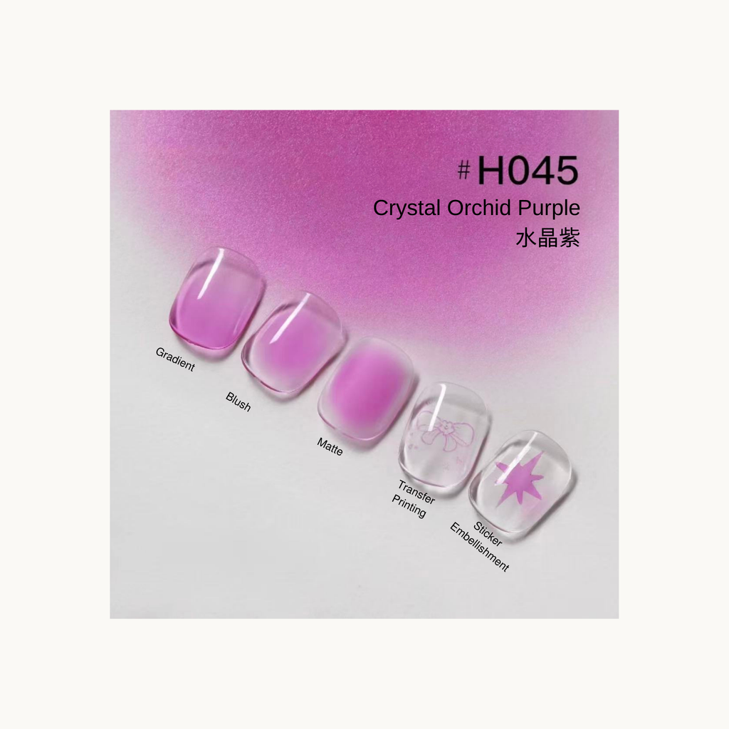 Taye Nformula Life crystal orchid purple press-on nails featuring gradient, blush, matte finish, and bow/star sticker accents.