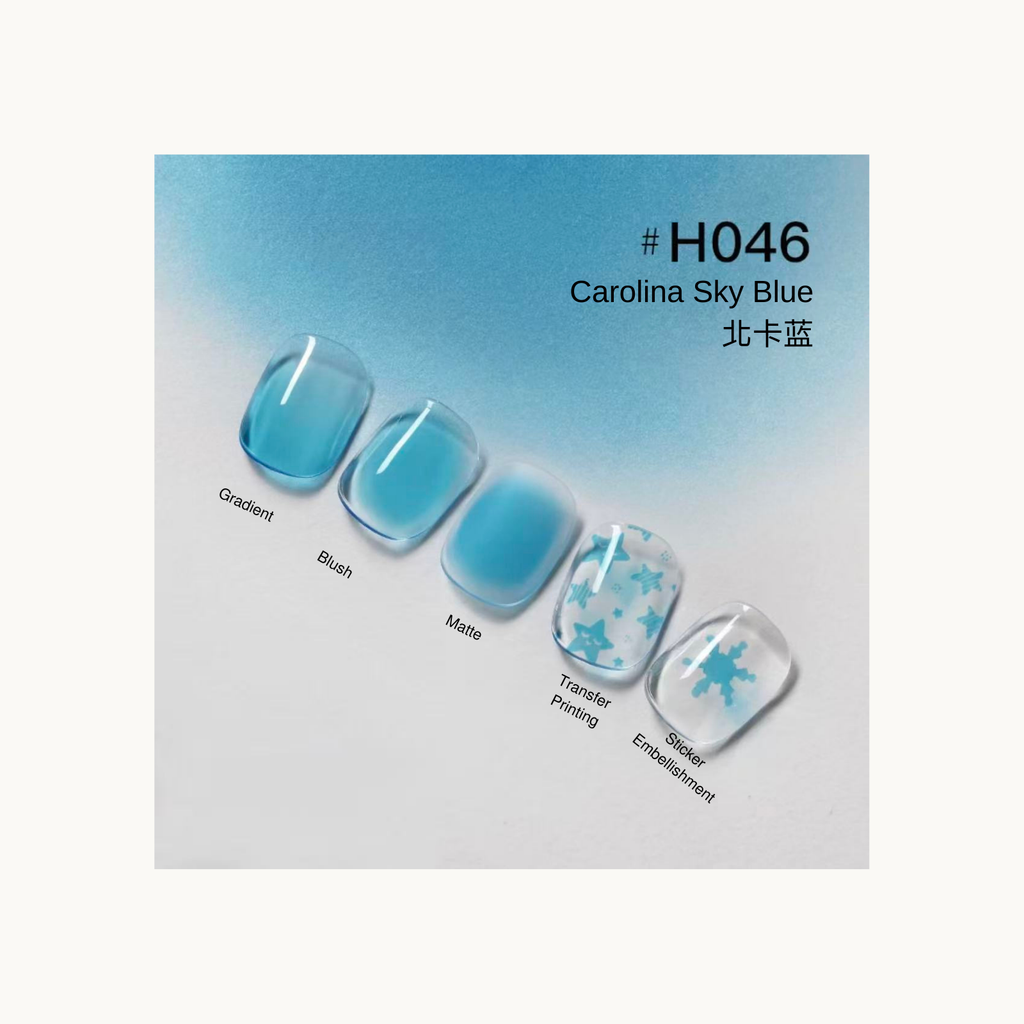 Taye Nformula Life Carolina sky blue press-on nails with gradient, blush, matte finish, and blue star/snowflake transfer designs.