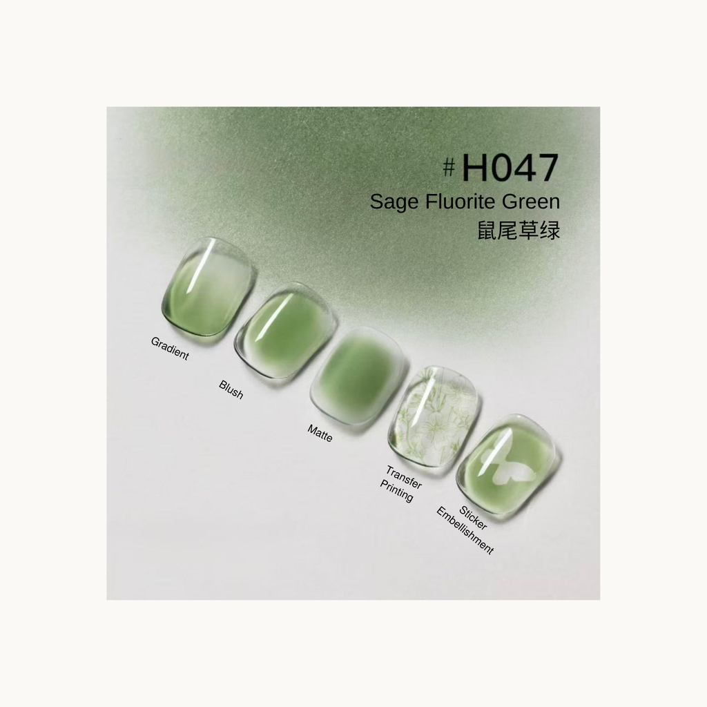 Taye Nformula Life sage fluorite green press-on nails with gradient, blush, matte texture, and botanical transfer printing.