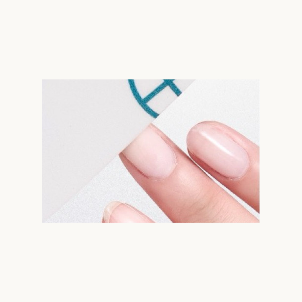 Close-up demonstration of MODING 100/150 grit baseball sponge buffer file gently smoothing nail surface