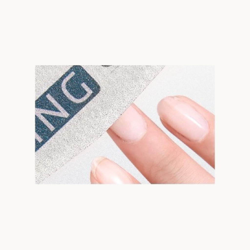 Close-up demonstration of MODING 150 grit diamond zebra file smoothing nail surface