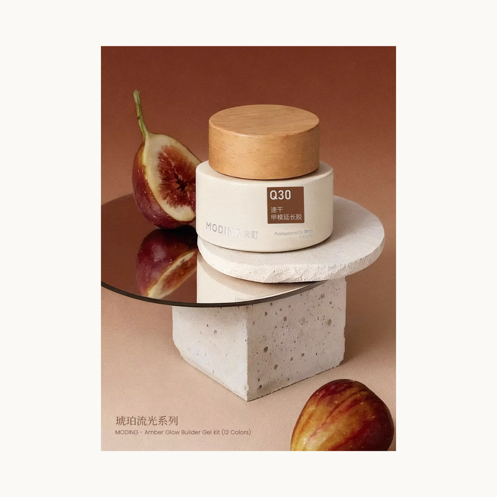 MODING Q30 builder gel photographed with figs and stone props, showcasing the Amber Glow series.