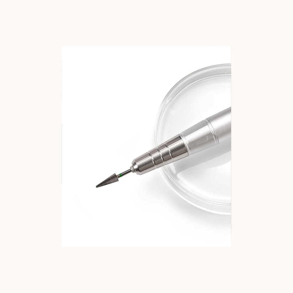 Close-up of MODING nail drill handpiece with precision drill bit, highlighting low vibration and smooth performance
