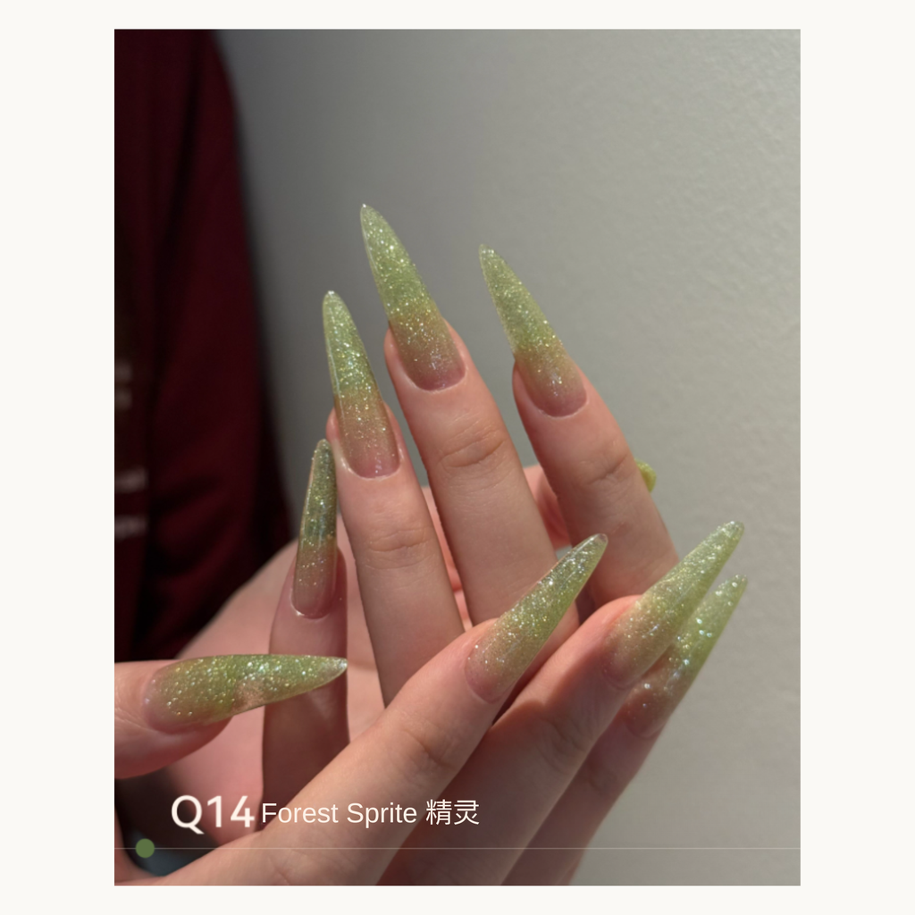 Green glitter ombré nails with a magical shimmering effect using MODING Q14 Fairy Green.
