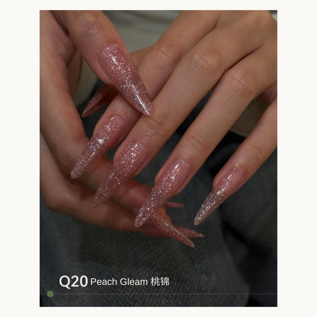 Peach-pink glitter gradient nails with a luminous shine using MODING Q20 Peach Gleam.