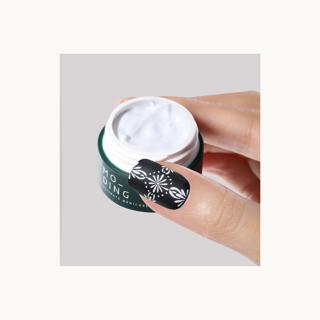 white nail art design using MODING painting gel shown with product jar close-up