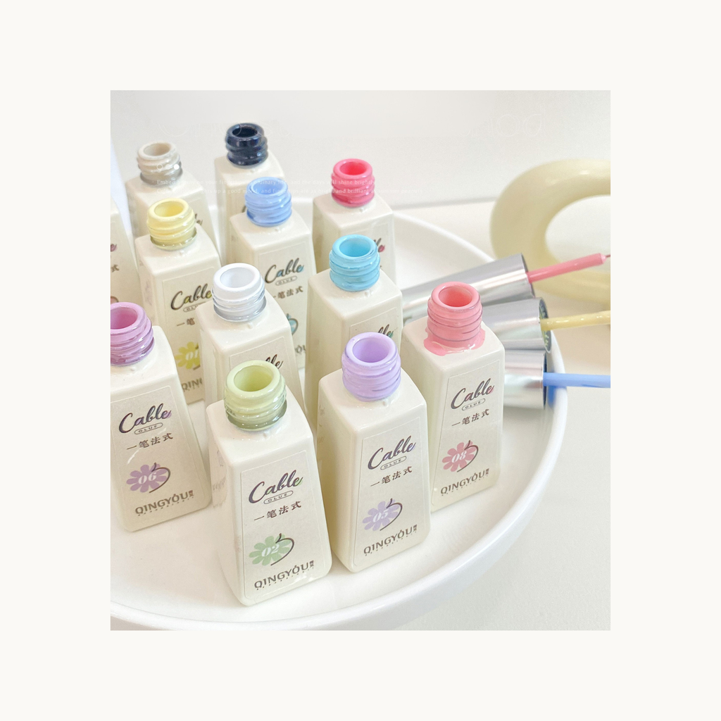 Top view of 12 open-bottle One Stroke French Gel shades showing creamy texture and pigment.