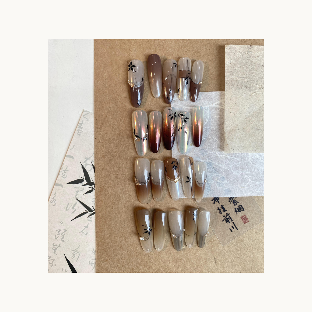 Caramel-brown gradient nail art designs with bamboo motifs created using QINGYOU Caramel Cocoa solid gel palette
