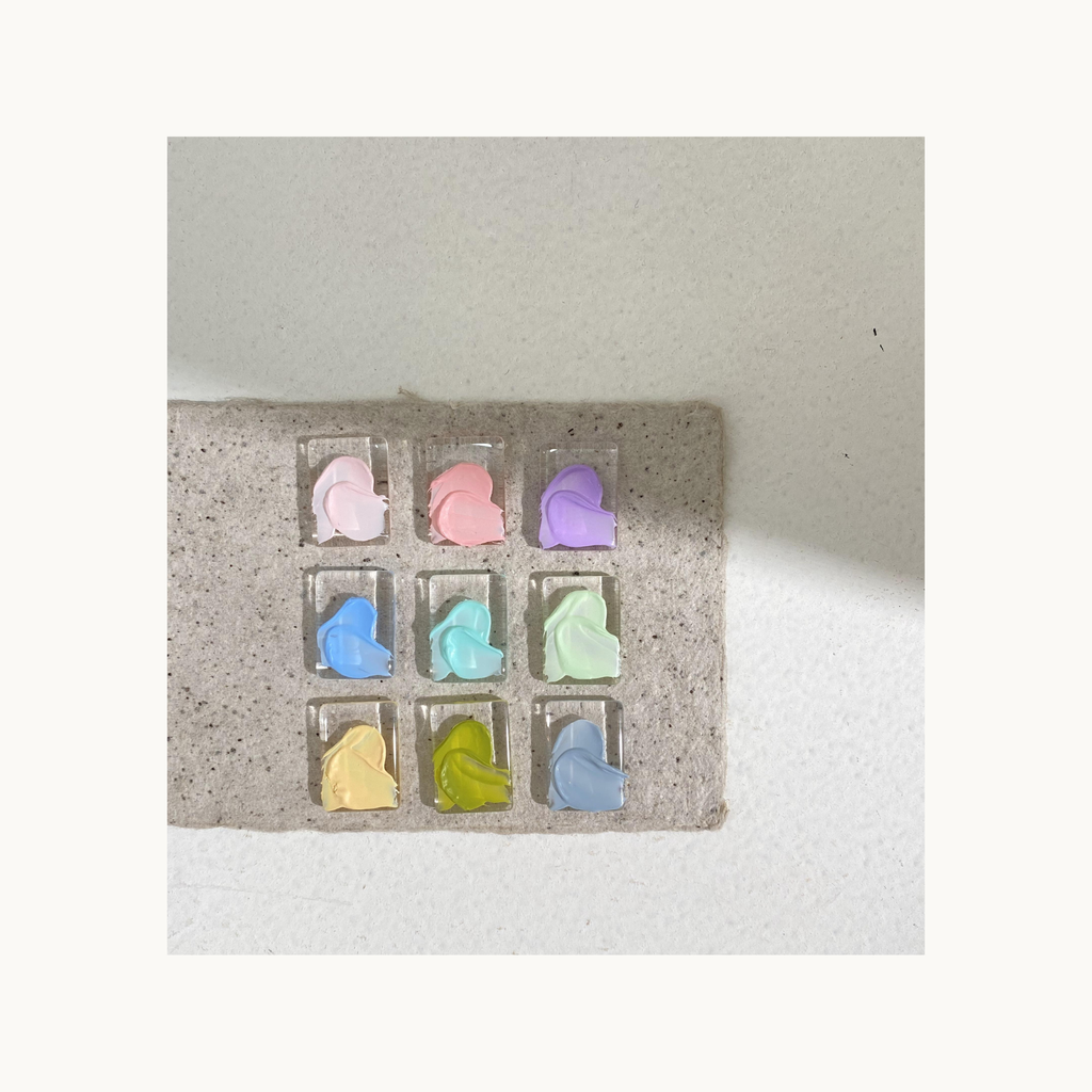 Nine-color pastel oil-painting texture gel swatches arranged in a grid from QINGYOU Lilac Ballet Palette