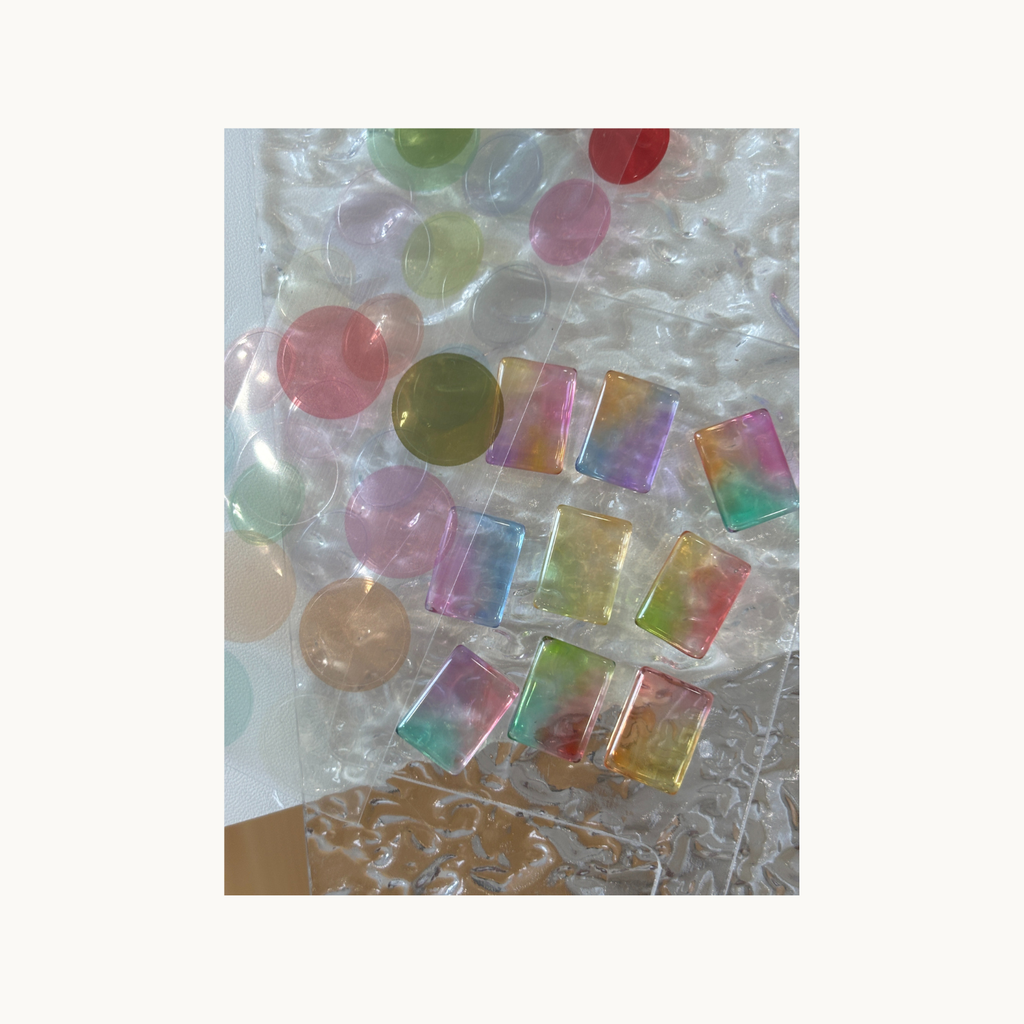 Rainbow translucent jelly pieces made with Qingyou Glazed Painting Gel on clear texture sheet