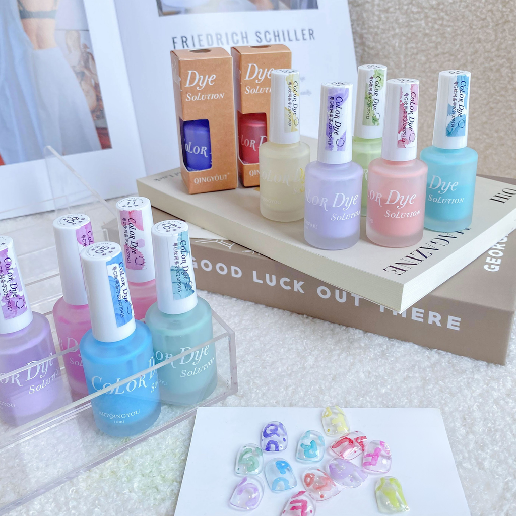 pastel color dye solution 12-color watercolor nail ink bottles and nail art samples displayed on books