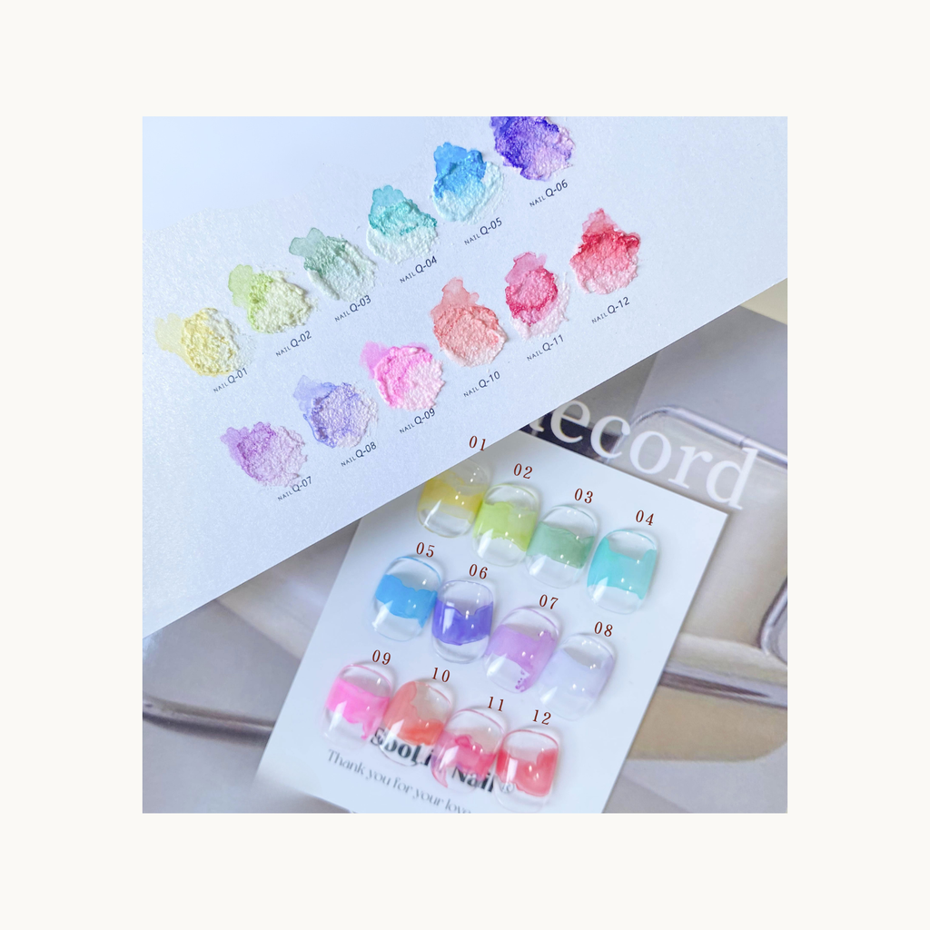 pastel color dye gel bottles arranged with small alphabet-style watercolor nail art samples