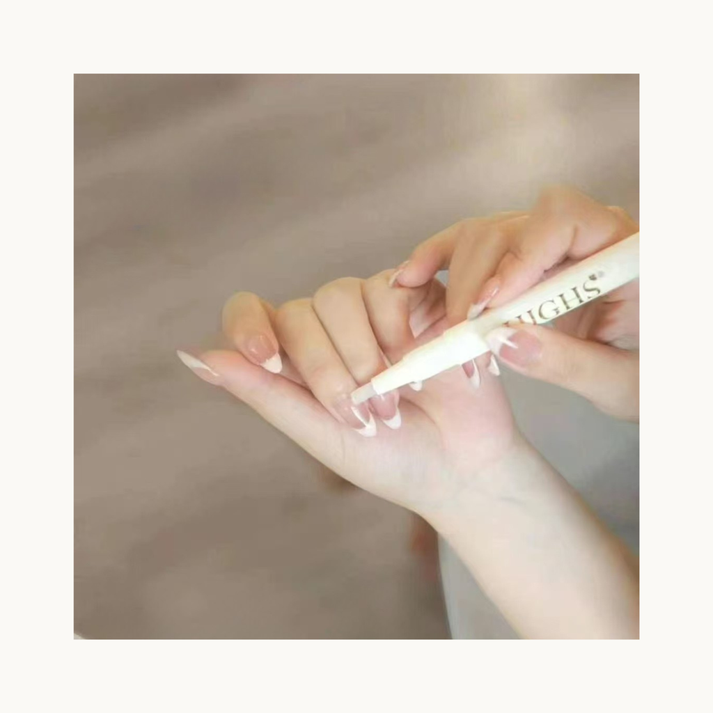 Demonstration of HIGHS cuticle care pen hydrating cuticles on manicure or French nails