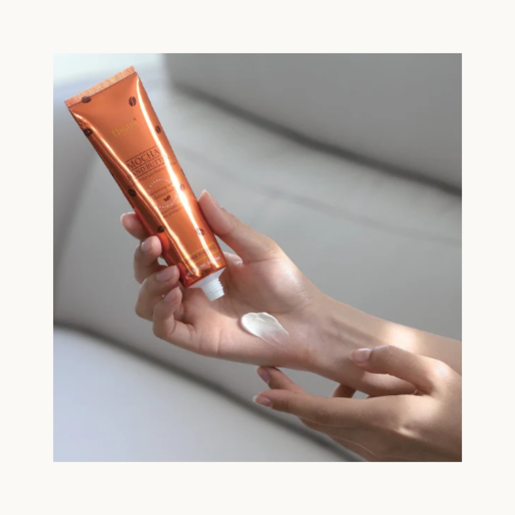 Applying HIGHS Mocha Hand Butter on hands to moisturize, repair fine lines, and improve skin softness