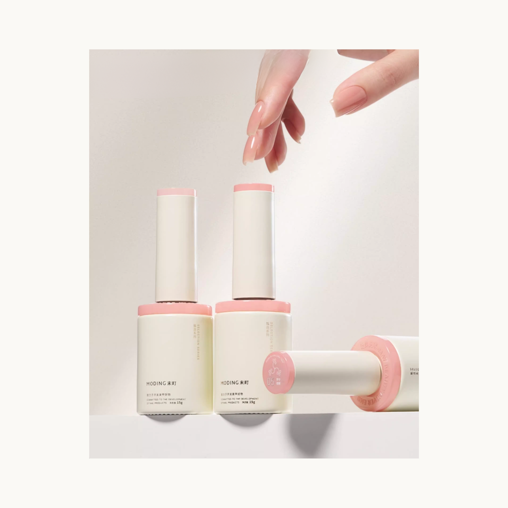MODING 3-in-1 builder gel bottles with a model hand showing sheer nude gel nails, suitable as base, builder, and color in one.