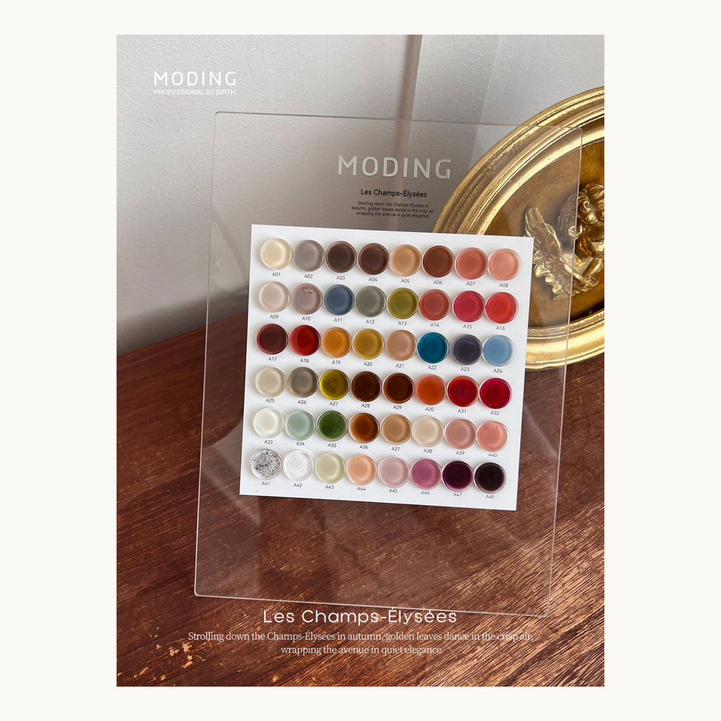MODING 48-color gel polish chart on acrylic stand, part of the Les Champs-Élysées series, highlighting natural, soft-tone nail colors for professional use.