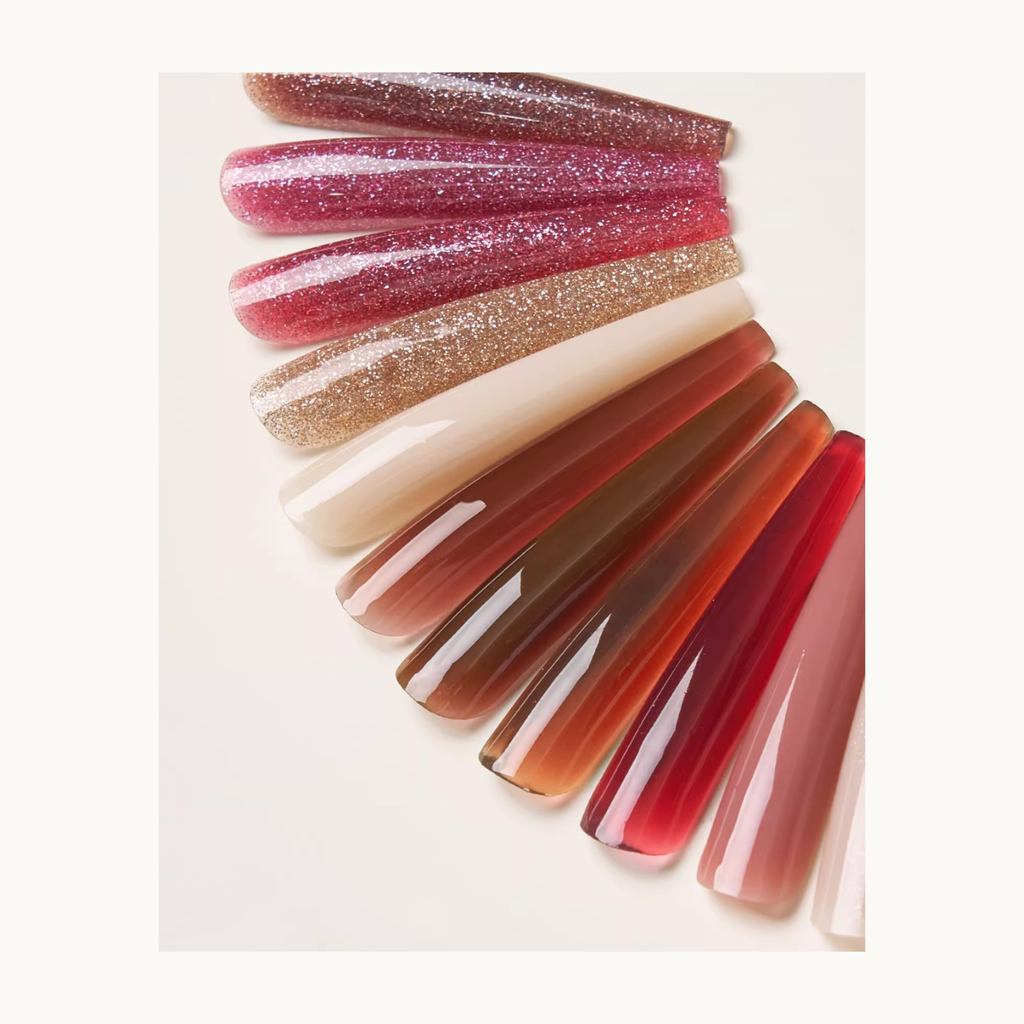 Close-up shot of MODING Amber Glow Builder Gel swatches featuring milky, amber, and glitter gradient shades.