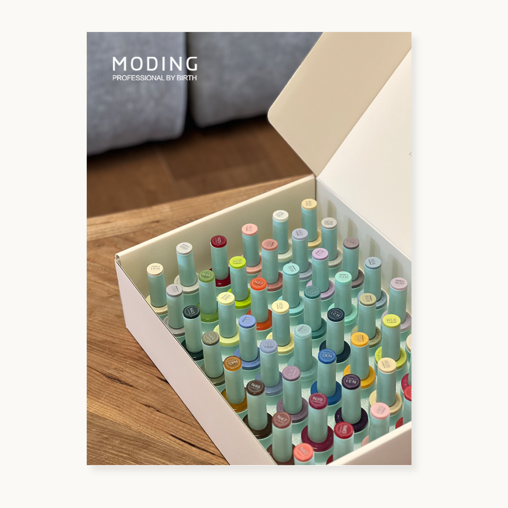 Flatlay of the hema-free, tpo-free and tmpta-free  gel brand Moding nail gel color chart and pastel pot gels, inspired by Southern France daylight.