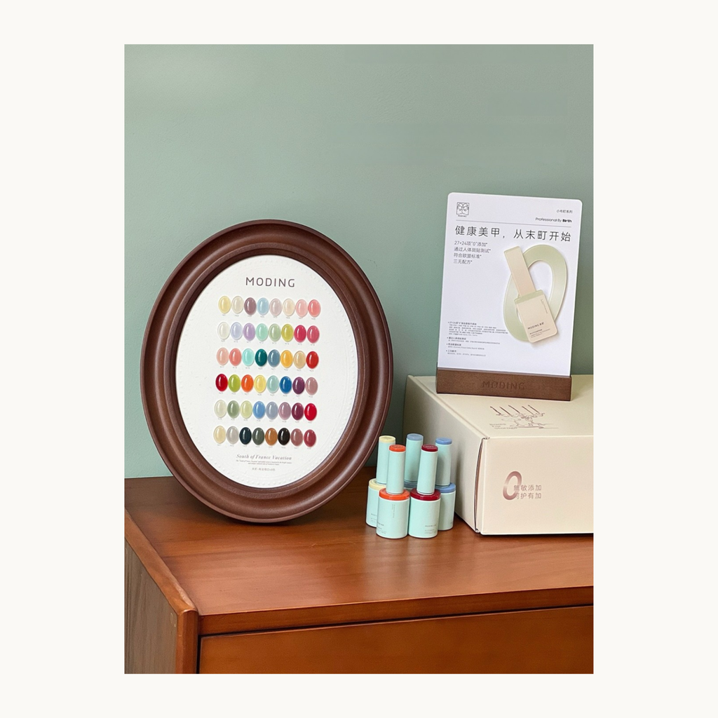 the hema-free, tpo-free and tmpta-free  gel brand Moding Full 48-color display of Moding South of France Vacation Collection pot gels, presented with an elegant wooden frame.