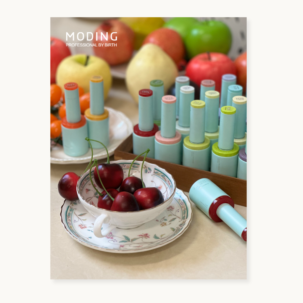 Lifestyle photo of the hema-free, tpo-free and tmpta-free  gel brand Moding French Collection nail gels styled with fresh fruits and soft 