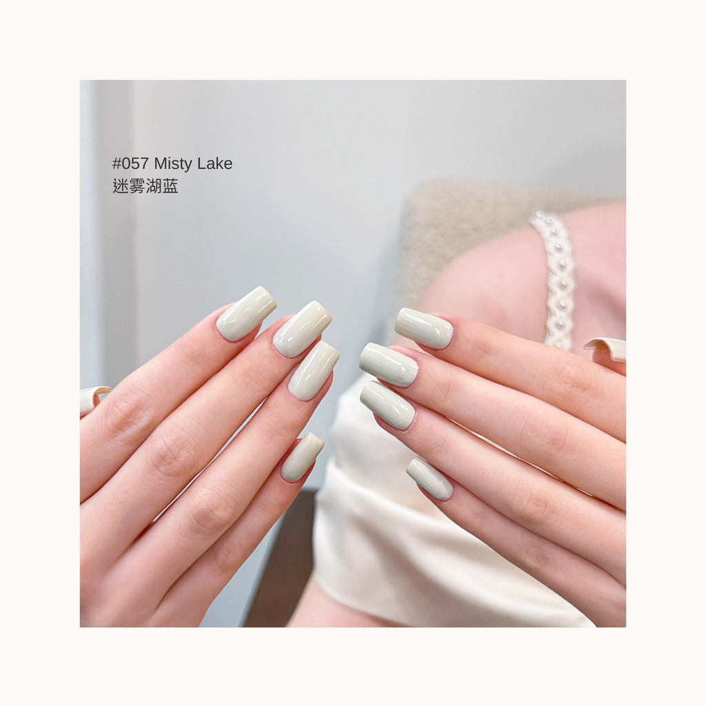 MODING M057 Misty Lake soft lake blue nail polish shown on hands