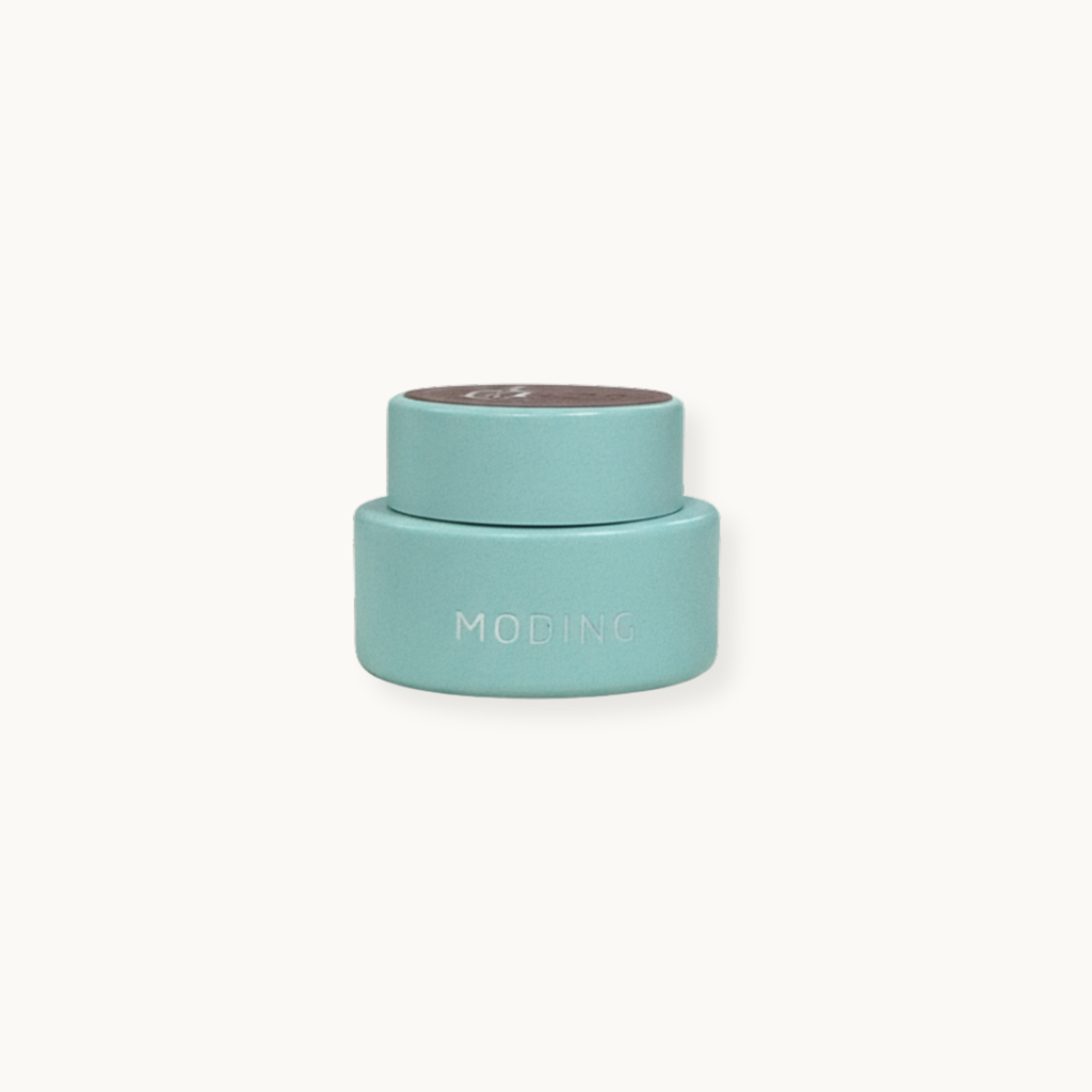 Minimal nail gel pot with mint green packaging and cream lid, Moding French Collection.