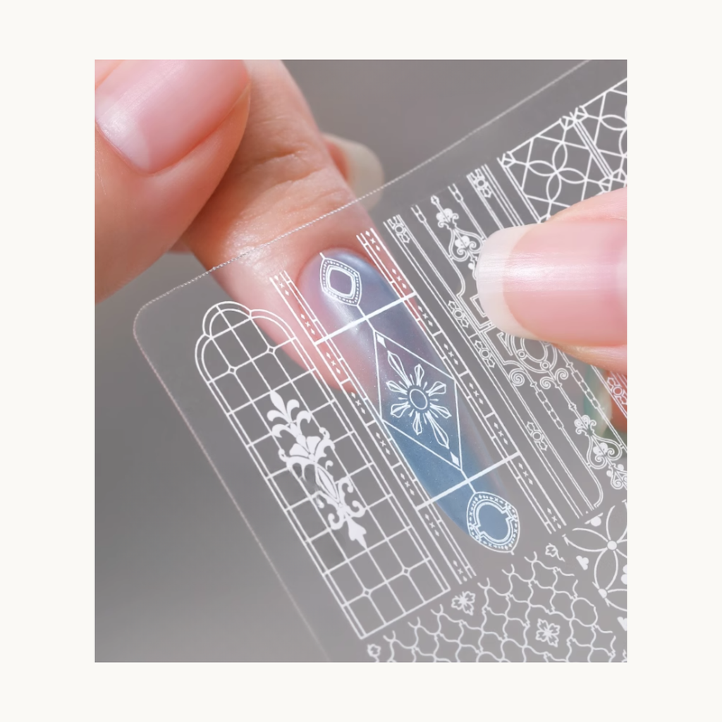 Transparent preview film being used to match nail size before stamping on Mr Nail stamping plate