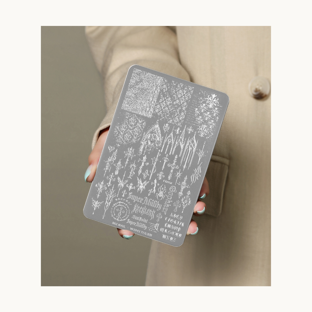 Hand holding MR NAIL W1041 Gothic Vintage nail stamping plate for size display