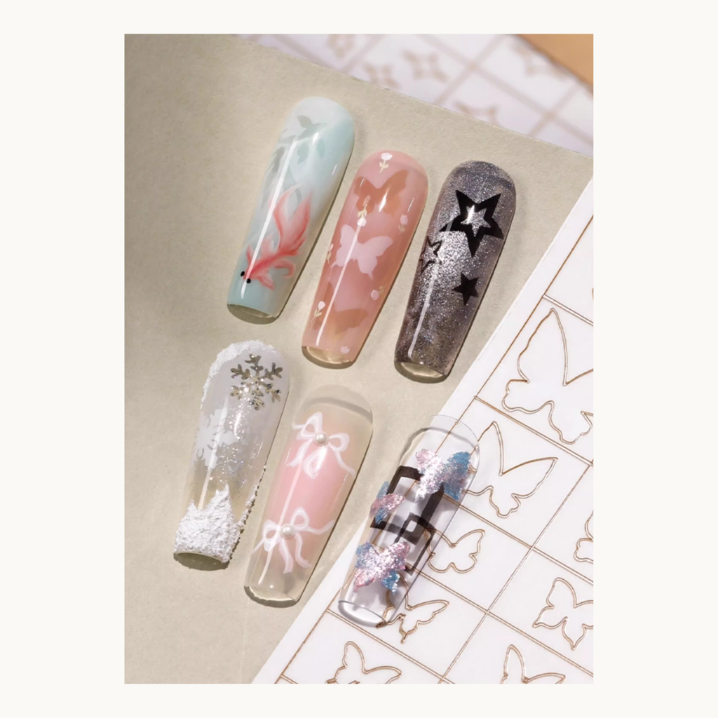 Nail art sample designs created using MR NAIL hollow stickers including snowflakes, butterflies, bows and stars