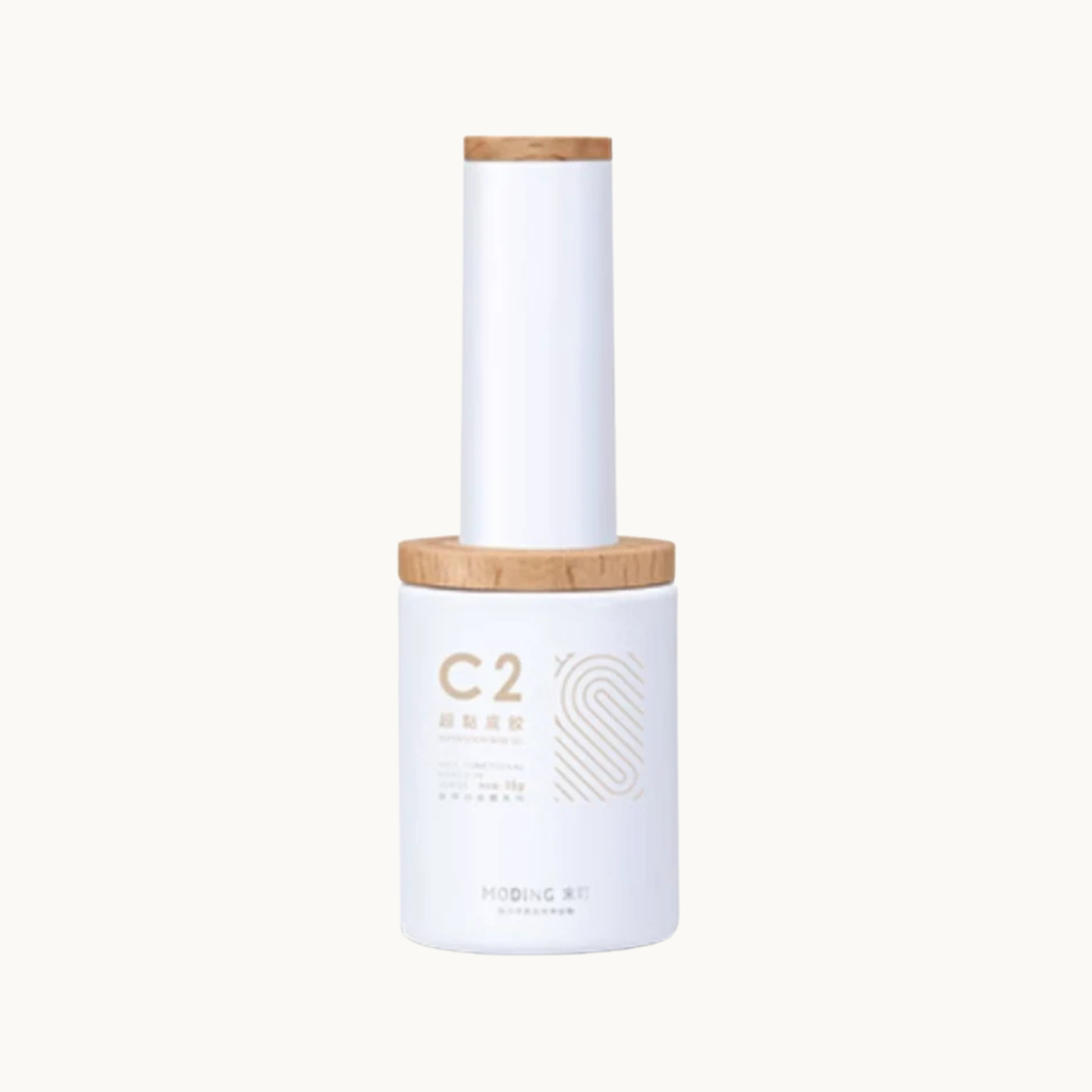 Moding C02 super sticky base nail gel bottle with wooden cap on white background
