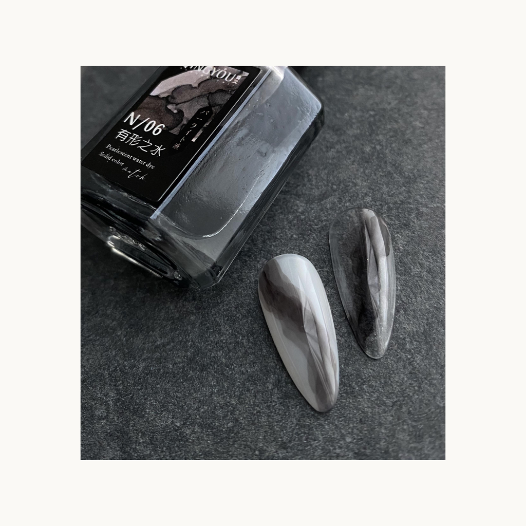 Close-up of QINGYOU black art ink with marble nail design samples