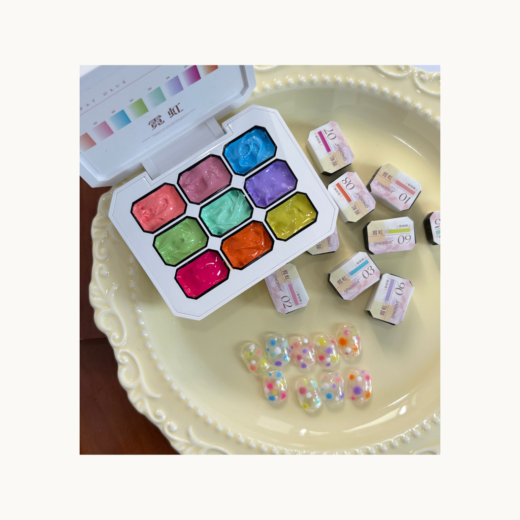 QINGYOU neon paint gel palette placed beside colorful dot pattern nail tips and gel color swatches.