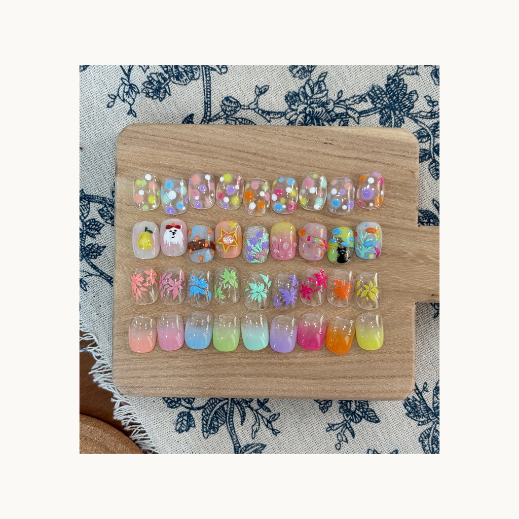 QINGYOU neon gel full nail art swatch board featuring dot patterns, floral designs, and gradient press-on nails.