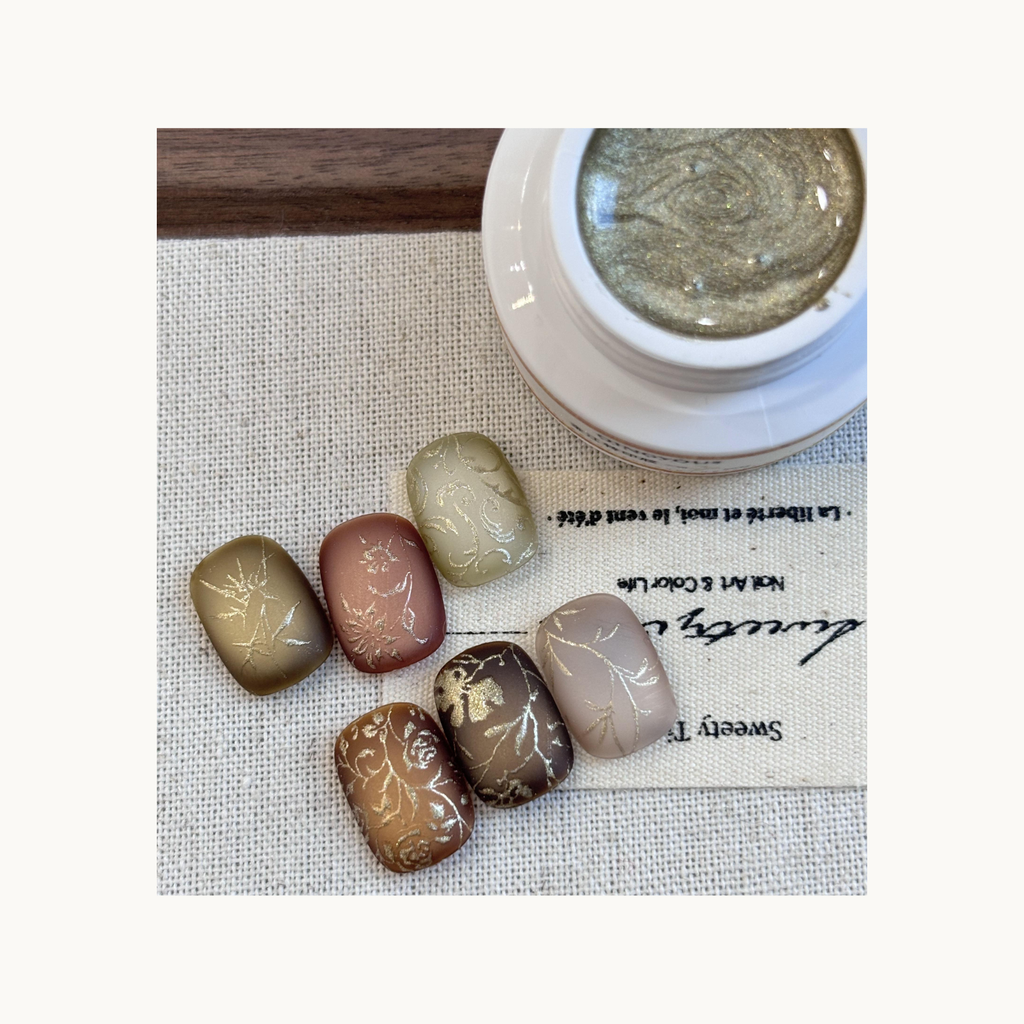 Burgundy matte nails with delicate gold embossed stamping using QingYou gold transfer gel.