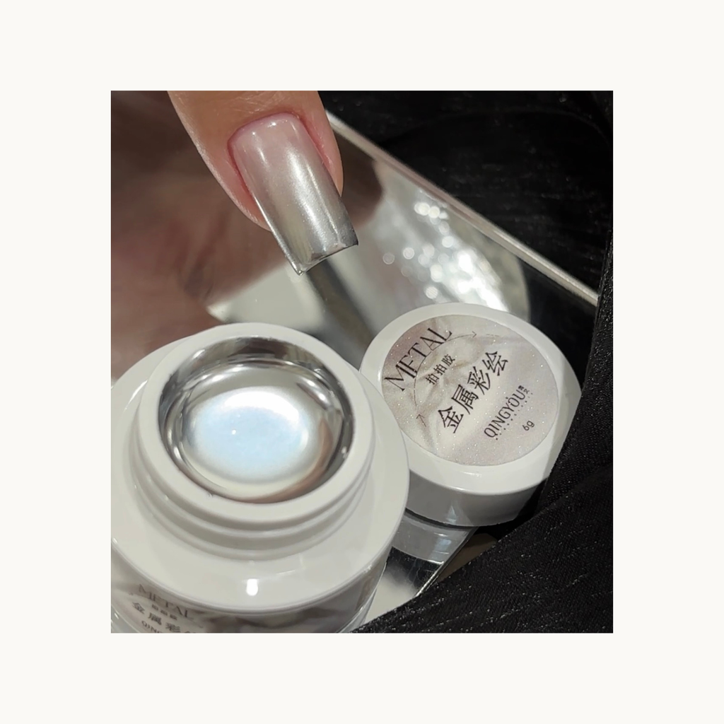 Demonstration of silver metal gel applied on natural nail showing reflective chrome finish