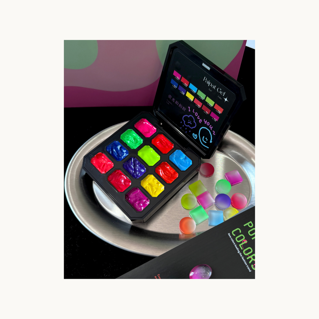 Close-up of QINGYOU neon 12-grid pat gel palette with bright fluorescent gel shades