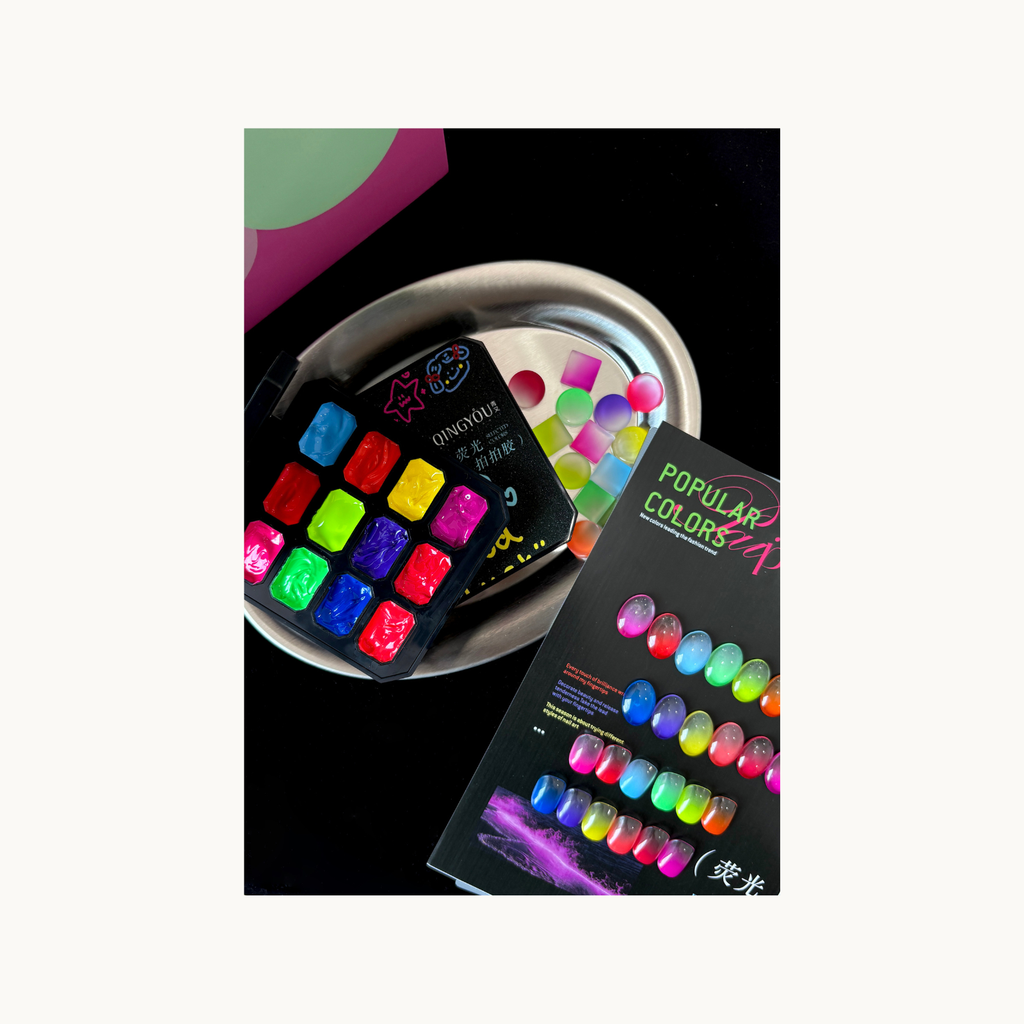 QINGYOU neon pat gel set displayed on metal tray with fluorescent jelly nail color samples