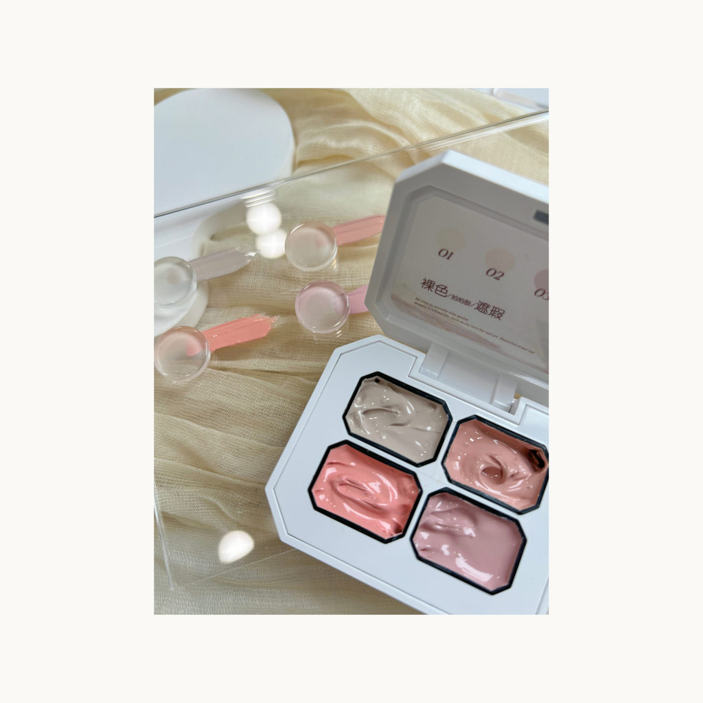 Nude gradient nail art created with QINGYOU 4-grid concealer gel, displayed on clear boards