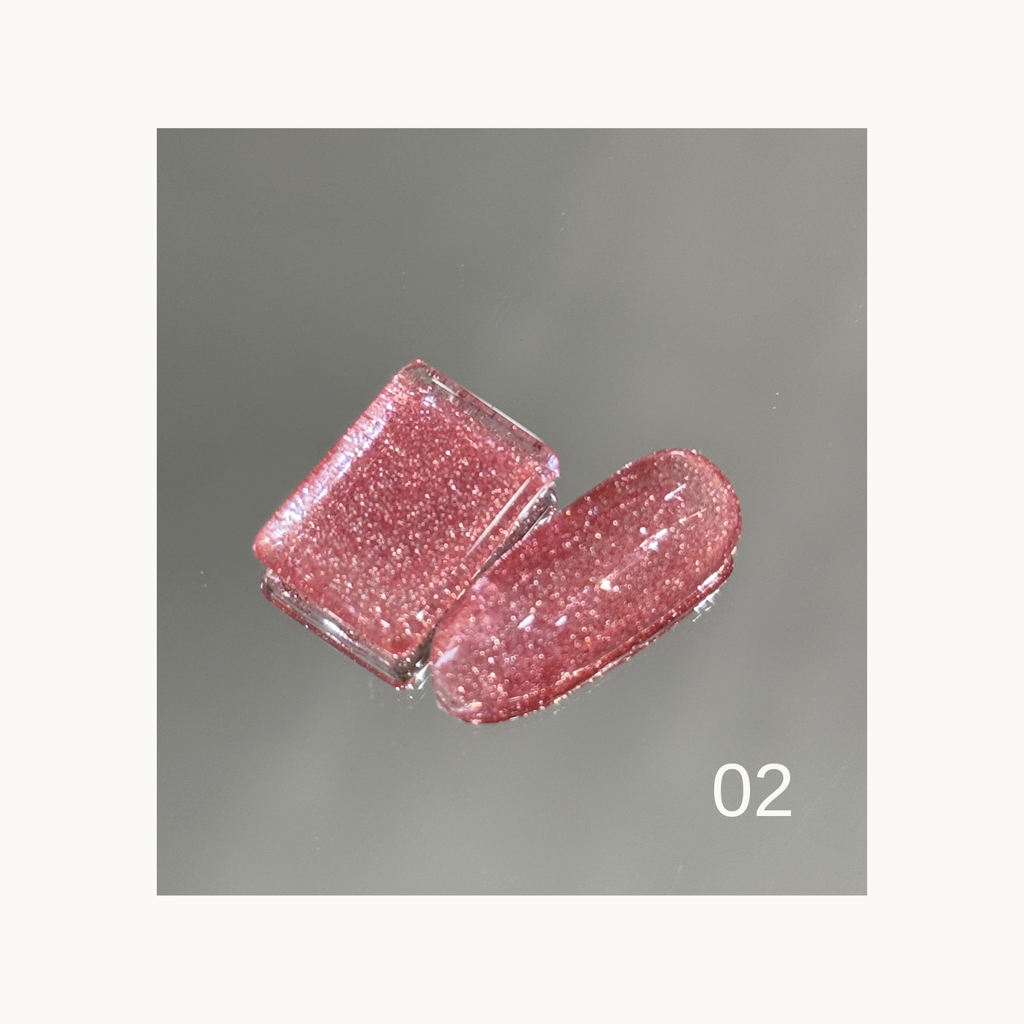 Texture swatch of rainbow diamond glitter gel demonstrating its high-shine sparkle.