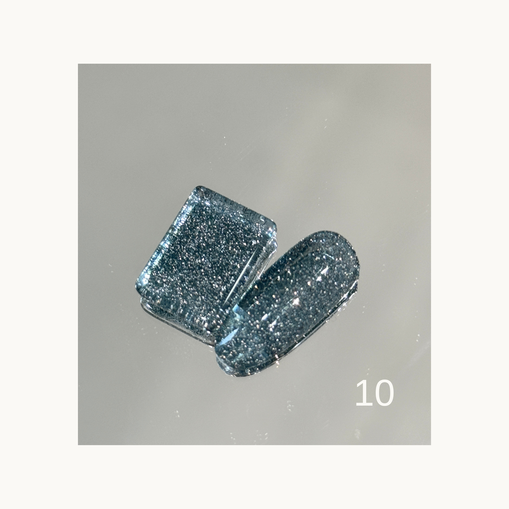 Qingyou Rainbow Glitter 10 icy blue glitter gel showing fine sparkly finish