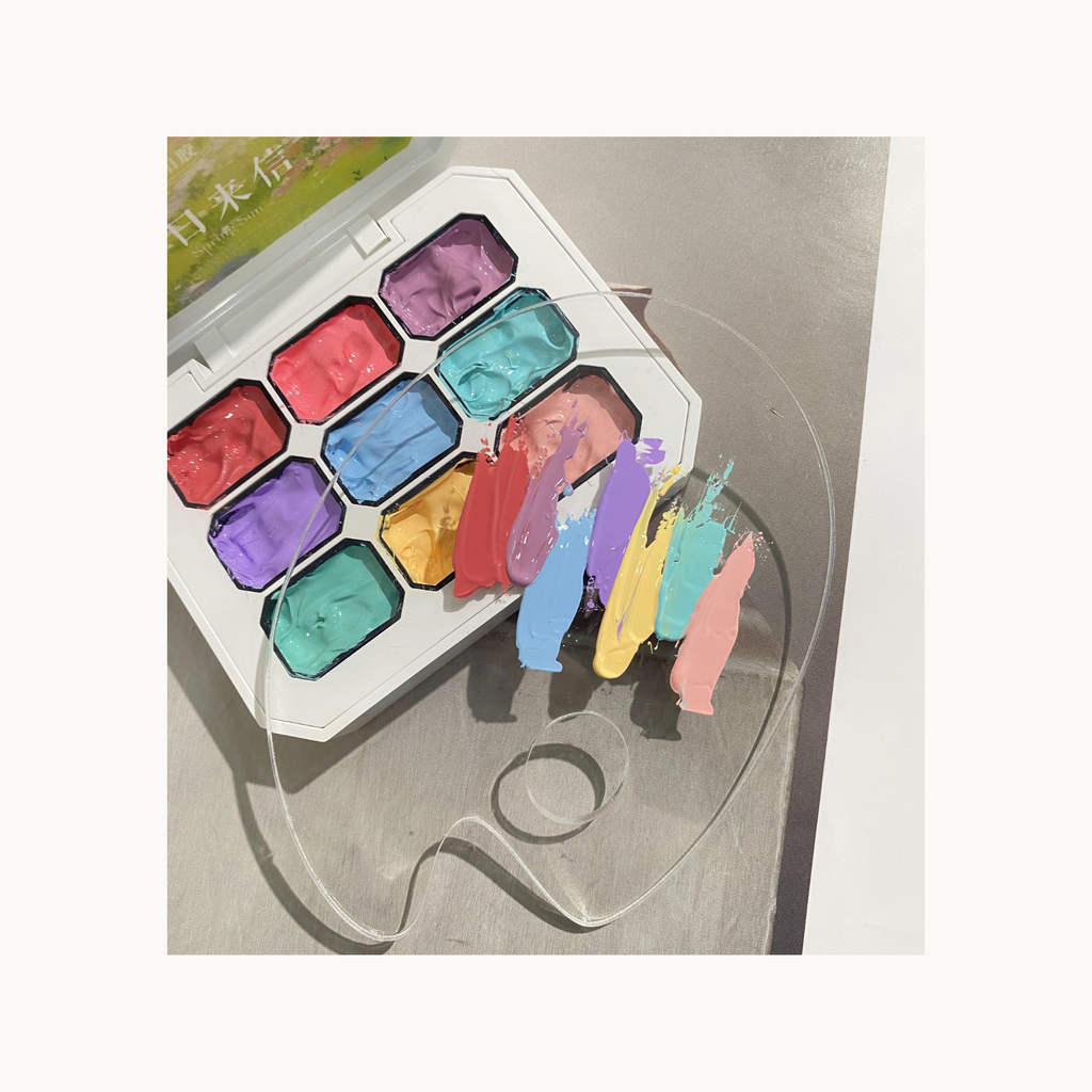 Pastel solid gel colors from QINGYOU Spring Sun palette mixed on a nail art board