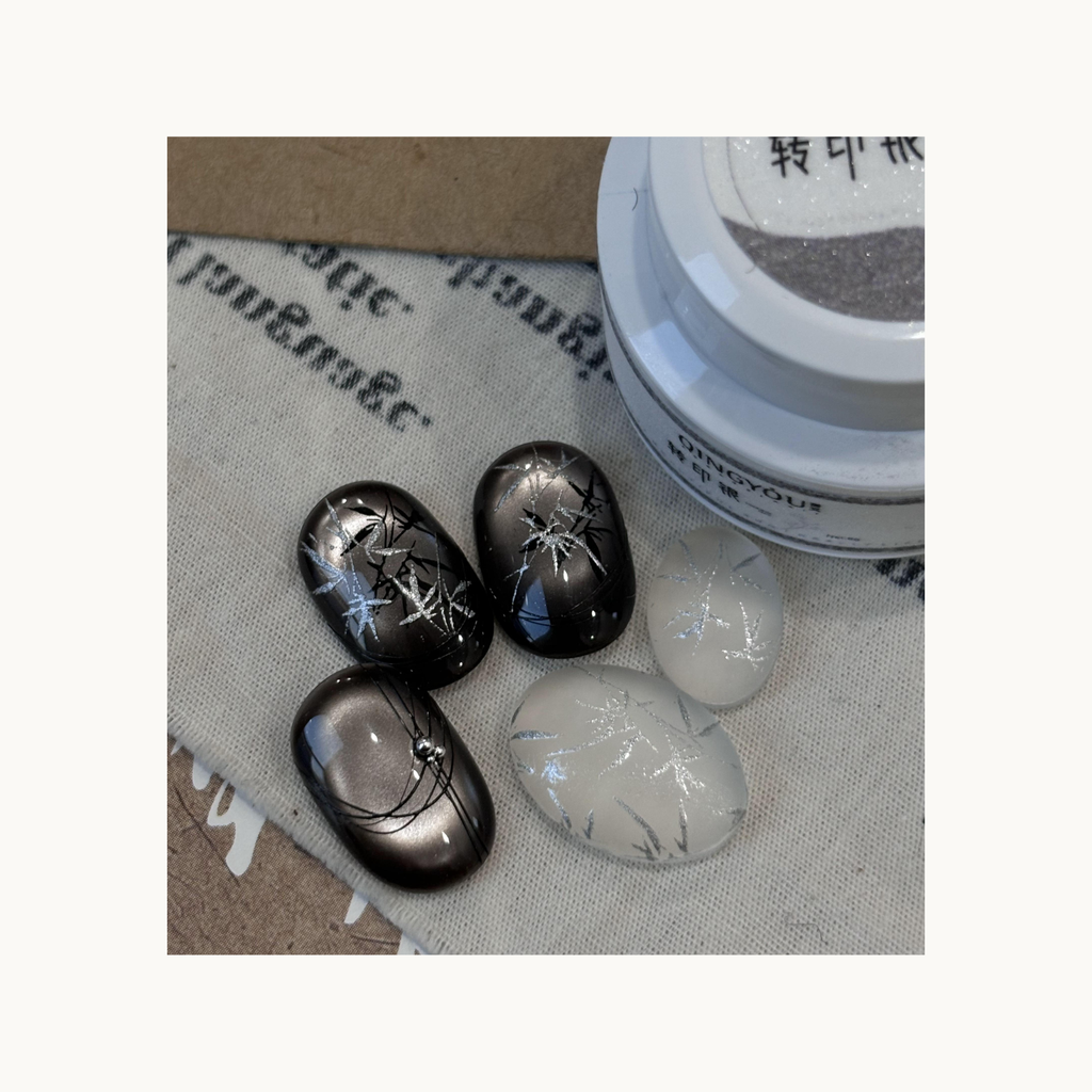 Silver transfer gel stamping nail art design using QINGYOU Transfer Silver Gel on black and milky bases