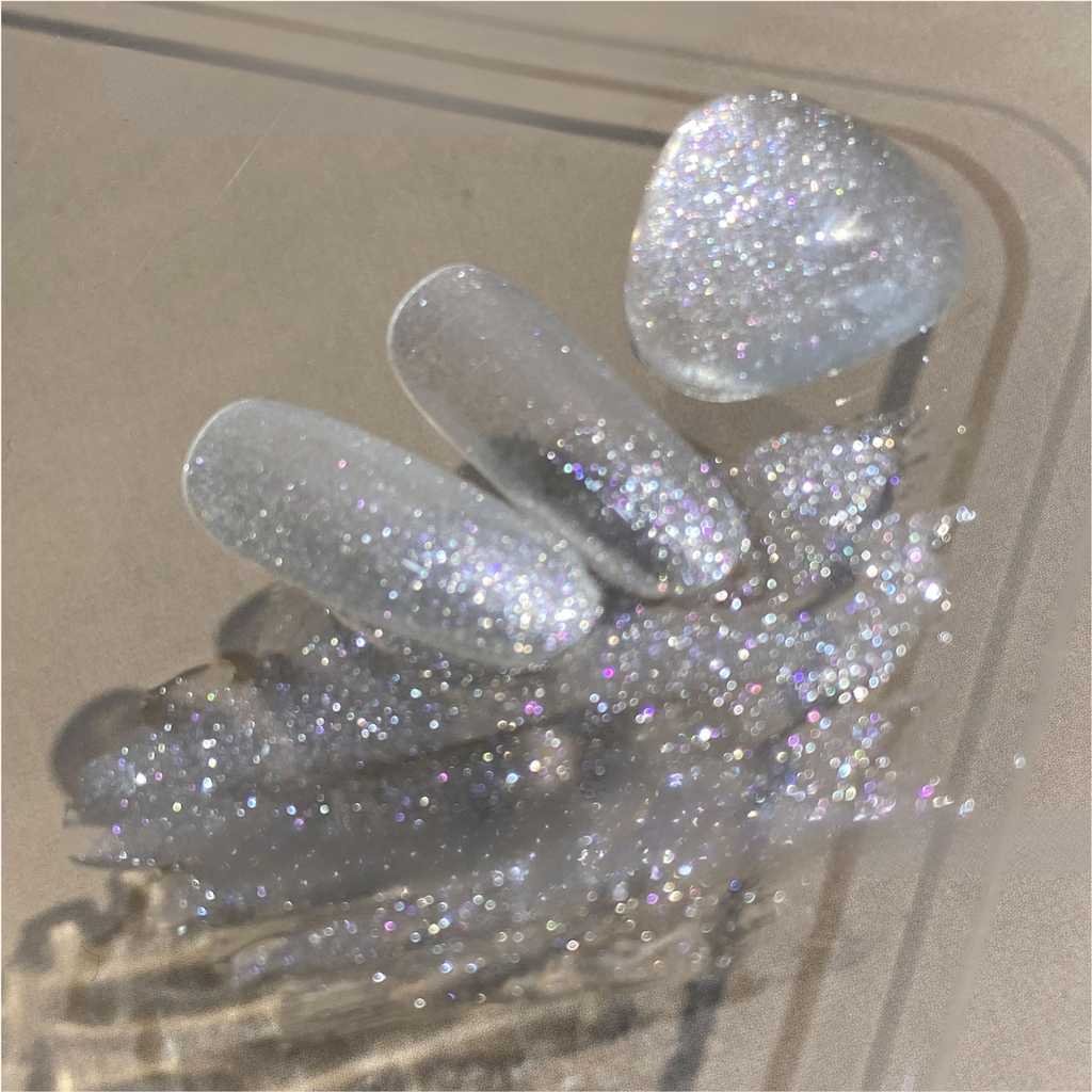 QINGYOU White Diamond Glitter Gel swatches showing high-shine silver sparkle for nail art