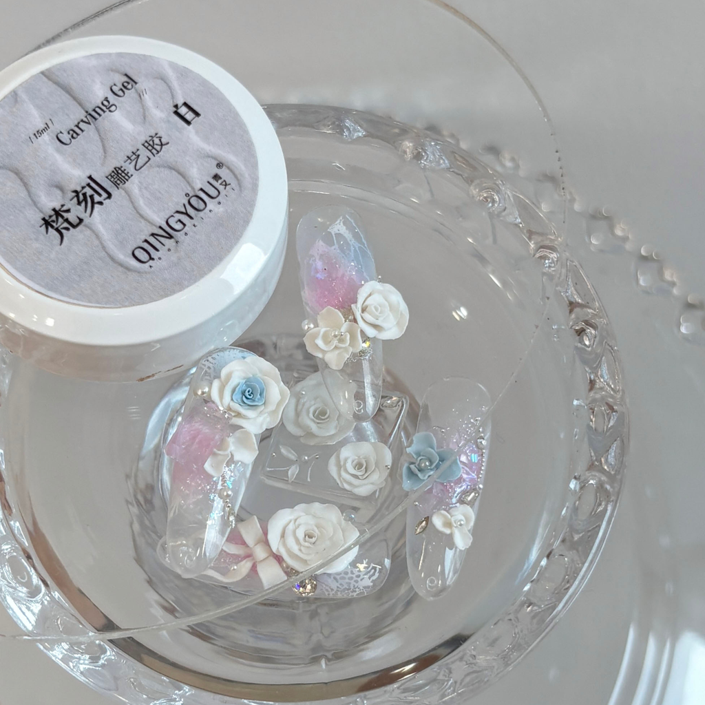 QINGYOU white relief carving gel with 3D floral nail art samples displayed on a clear plate