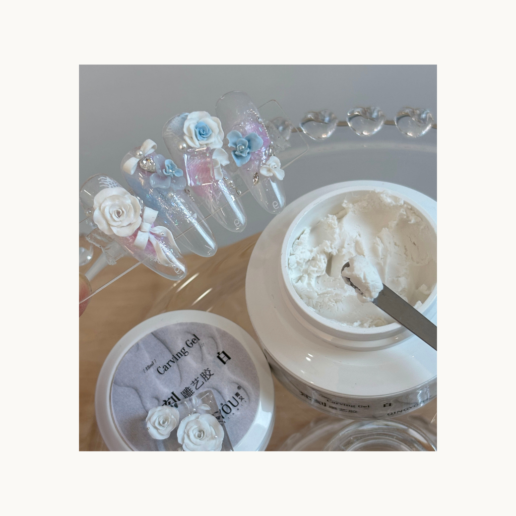 Gradient pink and blue nail art topped with sculpted roses created with QINGYOU white carving gel