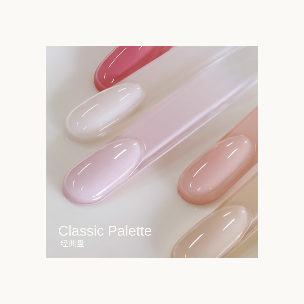 Close-up of Classic Palette sheer nude and blush gel color swatches with glossy texture for nail design.