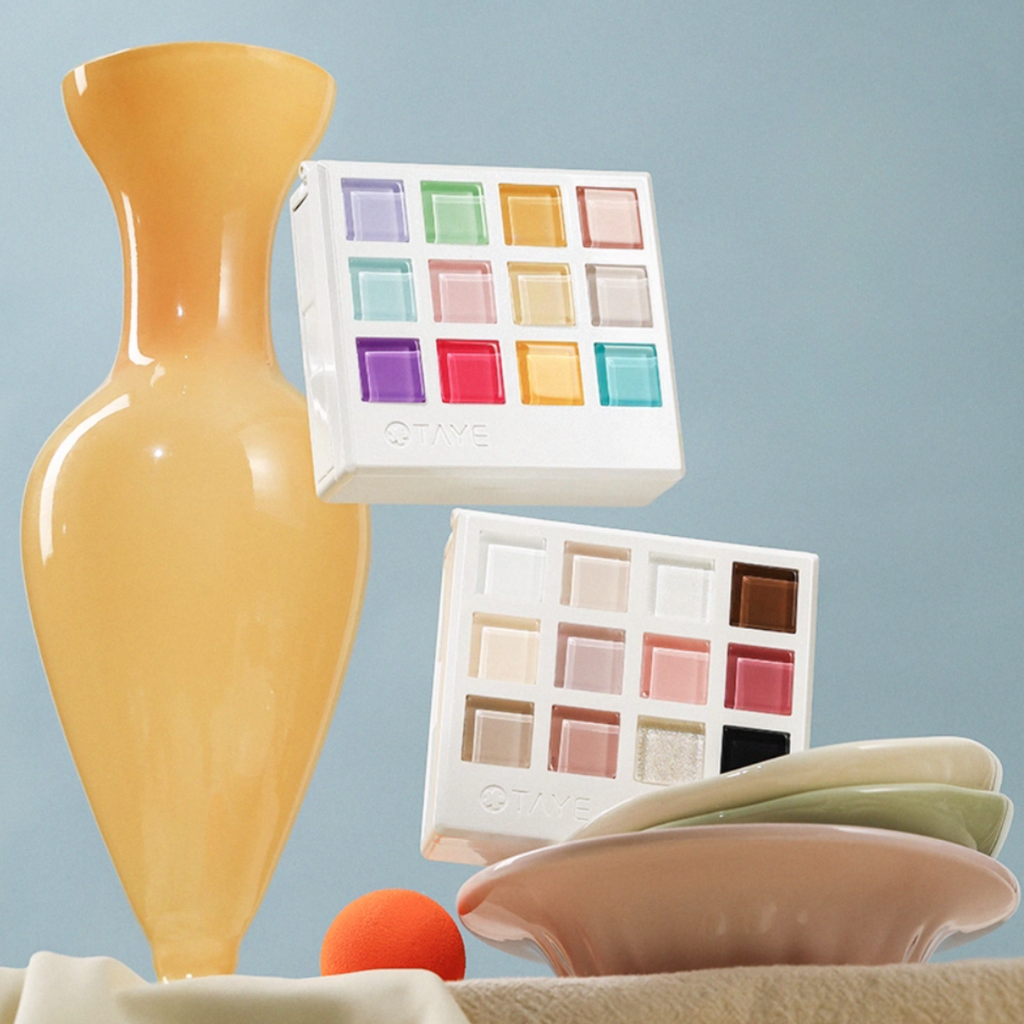 Two TAYE gel cube palettes displayed with soft pastel colors, showing professional nail art color options.