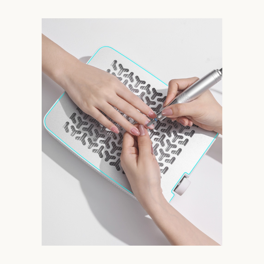 TAYE P079 nail dust collector used during nail filing, capturing acrylic and gel dust in professional salon settings